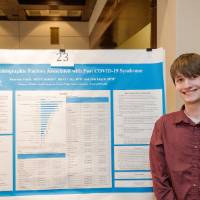 Harrison and his research poster